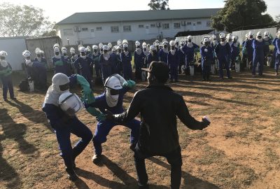 A-local-musician-dances-to-energize-the-spray-operators